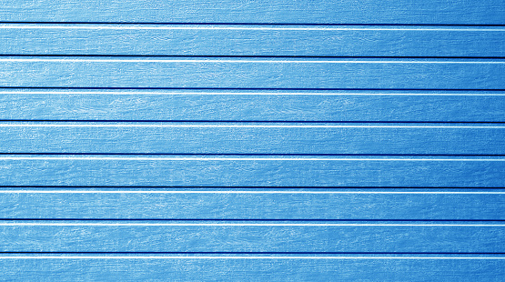 Plastic siding wall texture in navy blue color. Abstract background and texture for design.