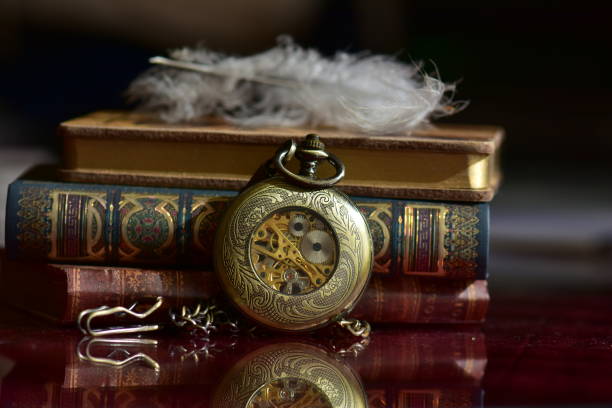 istock Old pocket watch and books 965420988