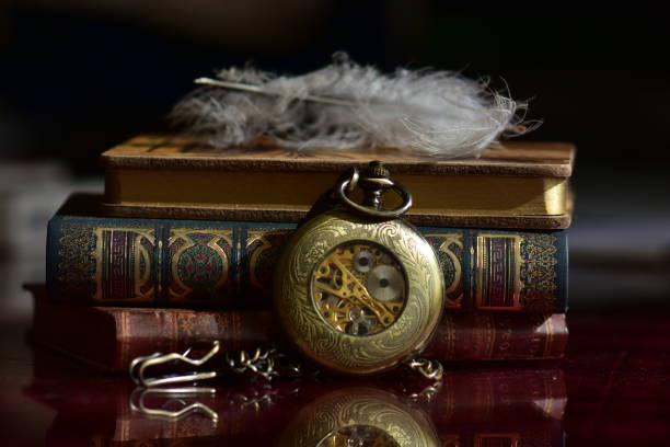 istock Old pocket watch and books 965421006