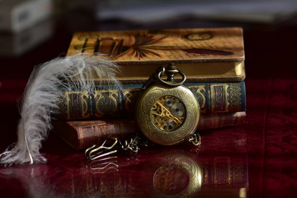istock Old pocket watch and books 965421194
