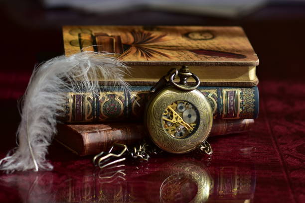 istock Old pocket watch and books 965421200