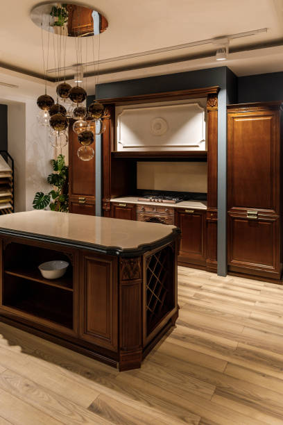 istock Stylish kitchen with chandelier over elegant wooden counter 965424016