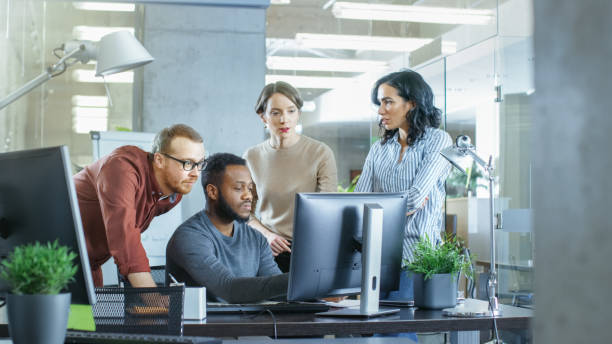 istock In Busy Corporate Office Team of Diverse Young Creative People Work on a Problem Solution. Collectively They Try to Help Coworker to Solve Problem. 965424452