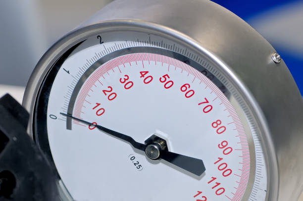 istock Pressure gauge on a blurry industrial background. 965424614