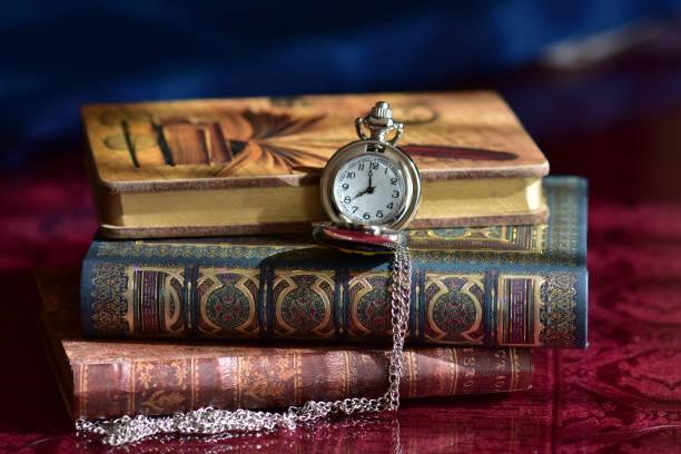 istock Old pocket watch and books 965424706
