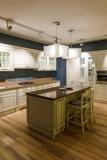 istock Stylish kitchen with elegant shiny table and chandelier 965424890