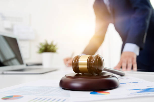 istock Wooden gavel on table. Attorney working in office 965425378