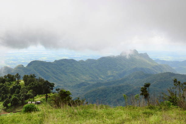 istock Tropical green mountain with moody sky in rainy day 965425408
