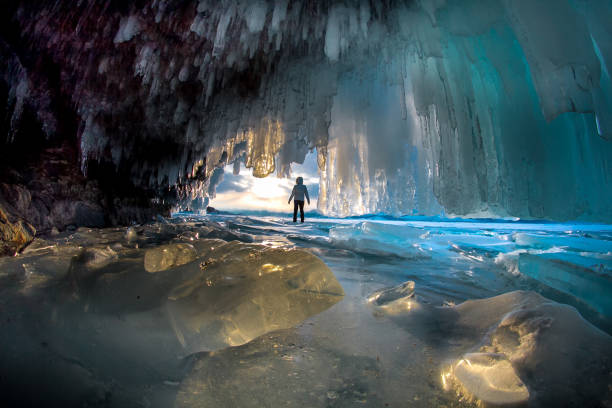 istock Man between the ice rocks on Lake Baikal on a clear day 965428540