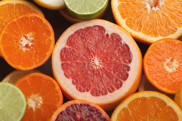 istock Cut citruses closeup. Juicy background 965429042