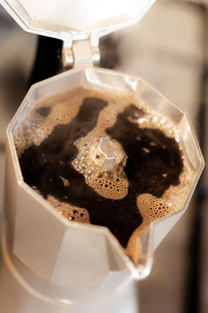 istock Hot fresh made coffee in Italian style mug close up view 965429358