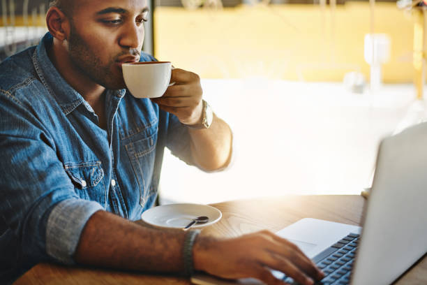 istock He enjoys his business and coffee combined 965431926