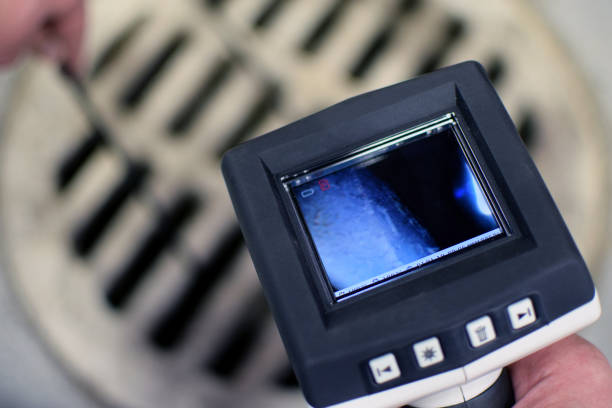 Borescope inspection camera Checking sewer manhole with borescope inspection camera. camera covers pictures stock pictures, royalty-free photos & images