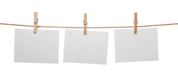 Blank Cards with Copy Space Hanging White blank cards with copy space on rope isolated on white background. clothesline photos stock pictures, royalty-free photos & images