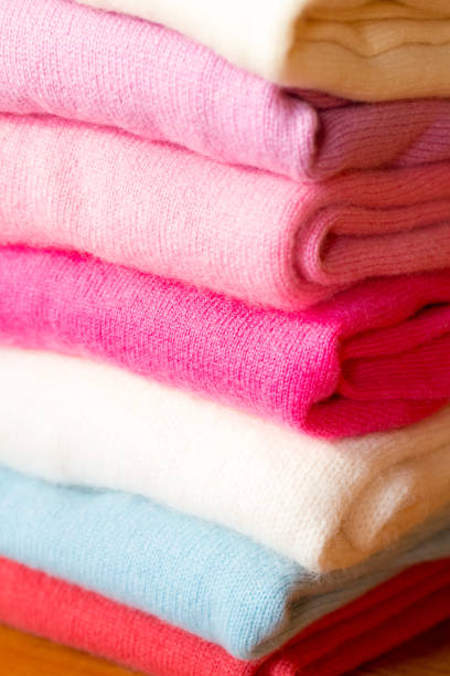 istock A stack of knitted sweaters of different colors lies. 965435910