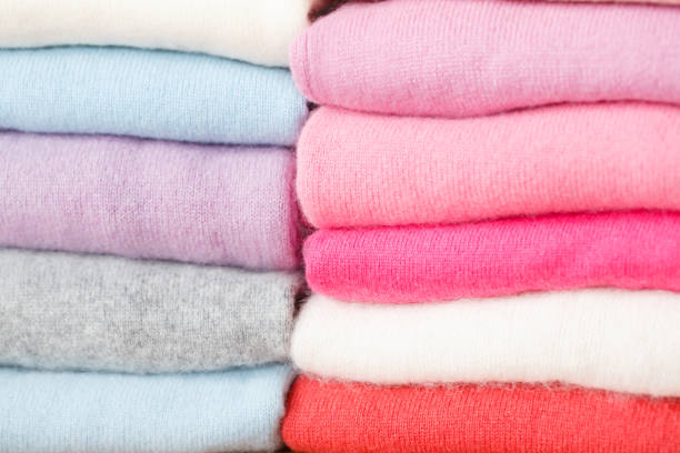 istock A stack of knitted sweaters of different colors lies. 965435978