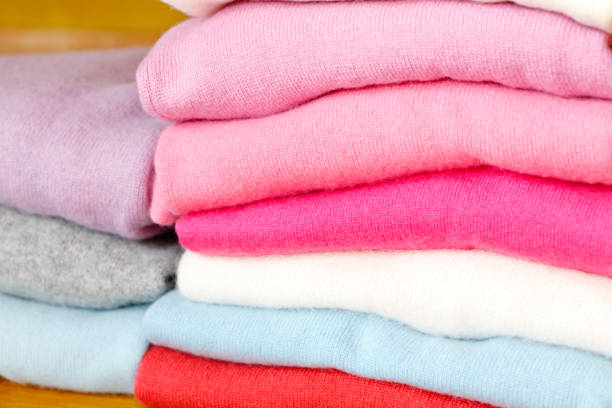 istock A stack of knitted sweaters of different colors lies. 965436016