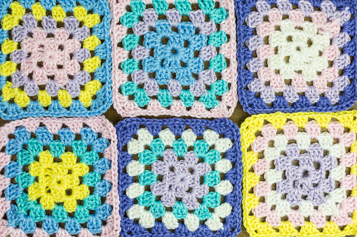 background of pastel colored granny squares
