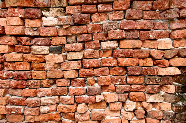 istock Cracked brick wall texture old background. Urban concrete and various rough grunge block. Close up. 965436118