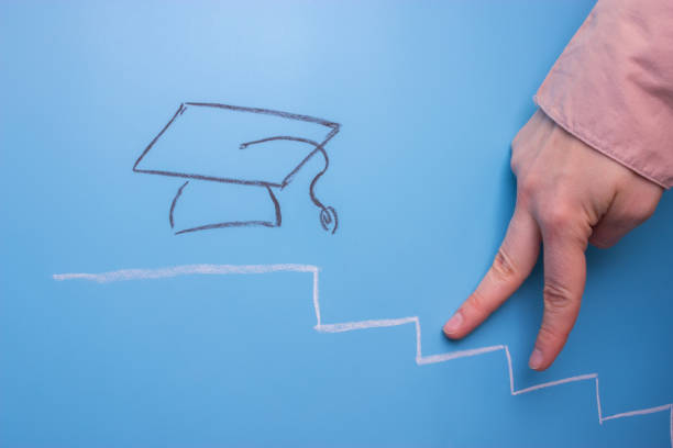 istock hand go up the stair to degree 965436502