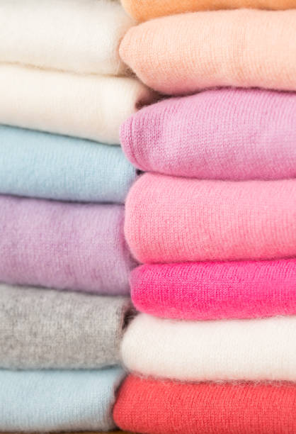 istock A stack of knitted sweaters of different colors lies. 965436580