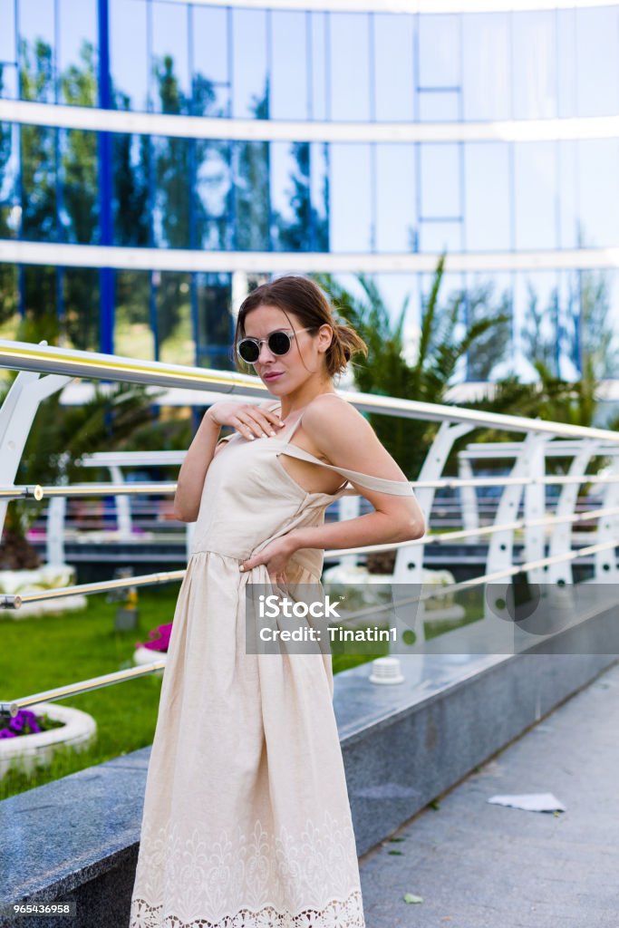 Beautiful woman walking in the summer city Beautiful young woman walking in the summer city Active Lifestyle Stock Photo