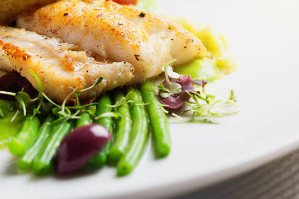 istock Gourmet dish of grilled fish with vegetables 965443884