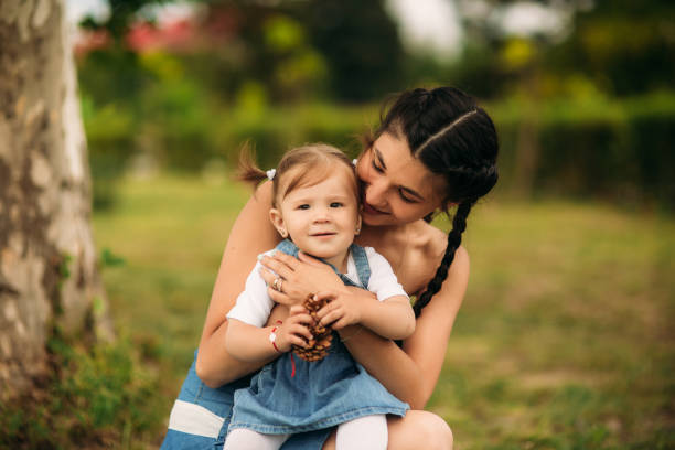 istock mom and daughter smiling and having fun 965444238