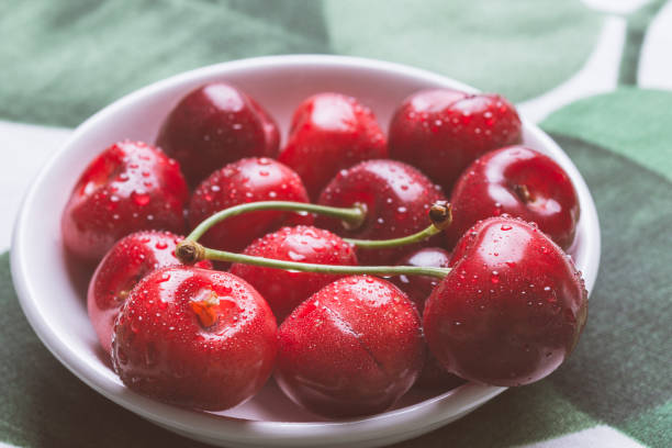istock Fresh Ripe Cherries in White Bowl with Copy Space. Summer and Harvest Concept. 965444594