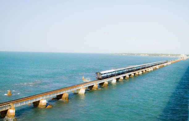 istock Train seen on Pamban bridge over water 965444896