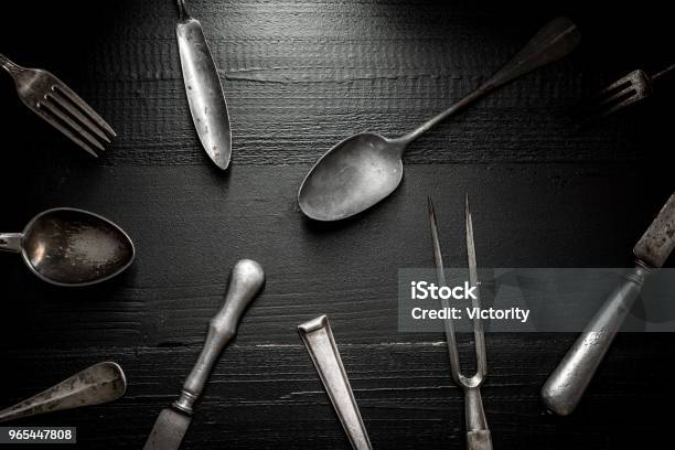 Old Rustic Cutlery On Dark Wooden Background Kitchen And Food Concept Stock Photo - Download Image Now