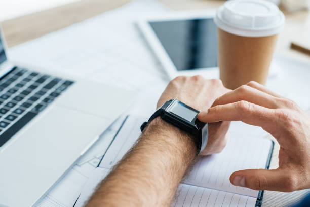 istock selective focus of person using smartwatch at workplace, cropped shot 965448092