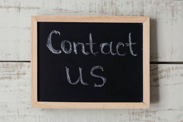 istock Contact us banner. Customer support and feedback. Blackboard with text 