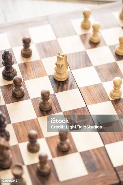 Closeup View Of Wooden Chess Board With Chess Board Stock Photo - Download Image Now