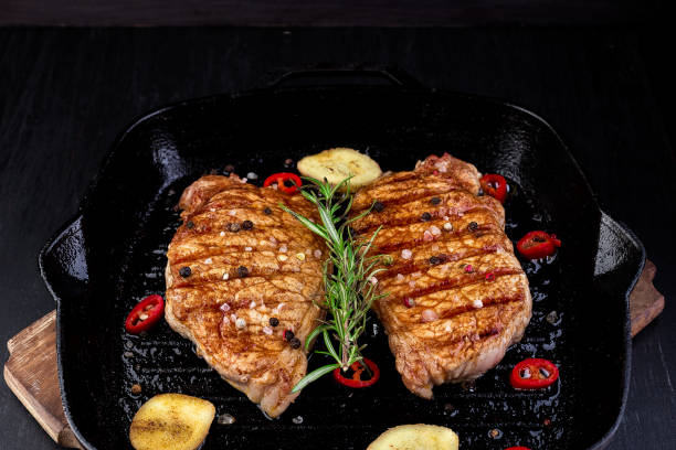 istock Grilled pork steak in grill pan 965451646