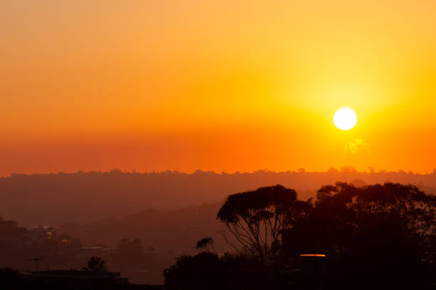 istock Incredible orange and red sunrise through a thick layer of forest fire smoke 965455038