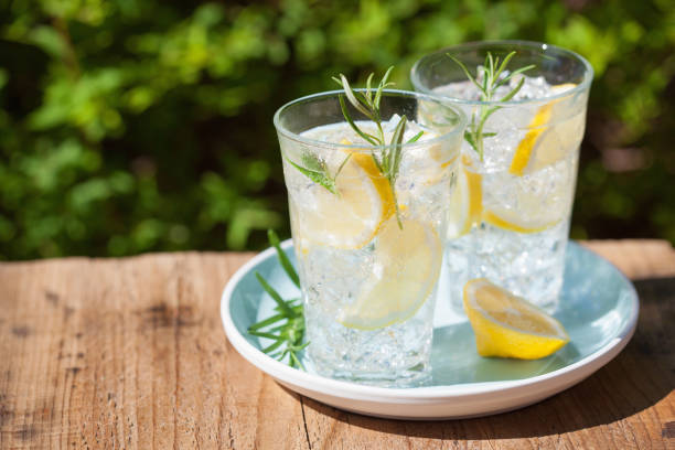 istock refreshing lemonade drink with rosemary in glasses 965455384