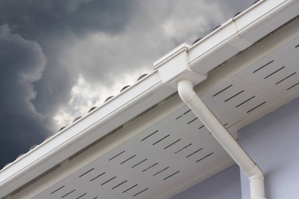 white plastic rain gutter and dark sky. concept : preparing maintenance rain gutter before rainy season. white plastic rain gutter and dark sky. concept : preparing maintenance rain gutter before rainy season. downspout stock pictures, royalty-free photos & images