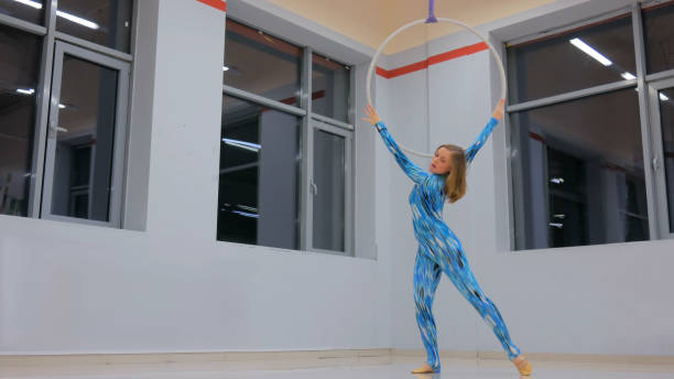 istock Plastic beautiful girl gymnast on acrobatic circus ring 965461676