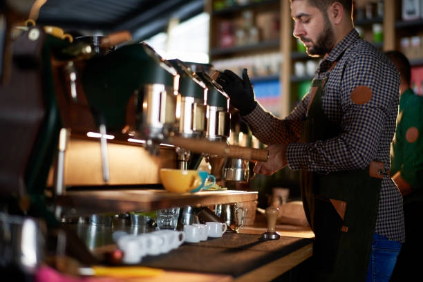 istock Barista in coffee shop 965462816