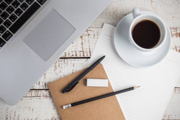 istock wood desk texture with coffee cup and supplies office top view 965466020