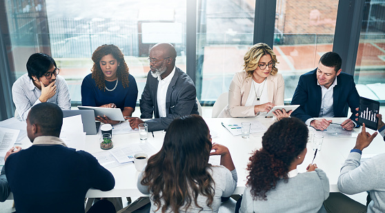 Shot of a group of diverse businesspeople having a meeting in a modern office