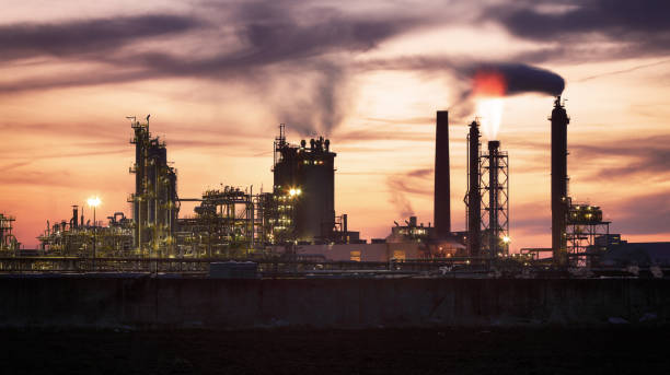 istock Factory with air pollution, Oil industry 965470356