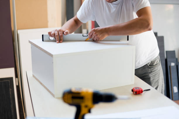 istock Carpenter measuring furniture 965470778