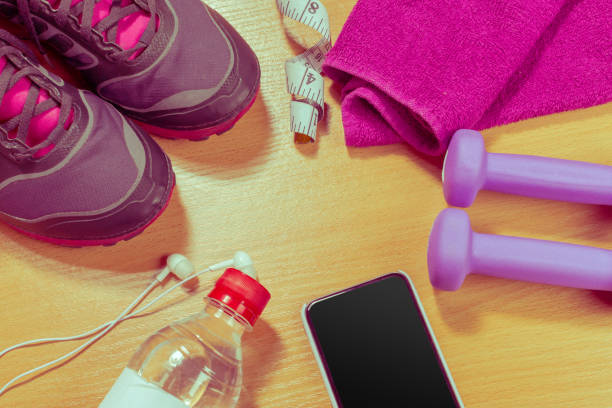 istock Sport stuff on wooden table, top view 965471500