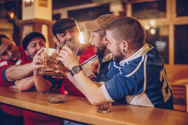 istock Cheerful fans drinking beer 965474022