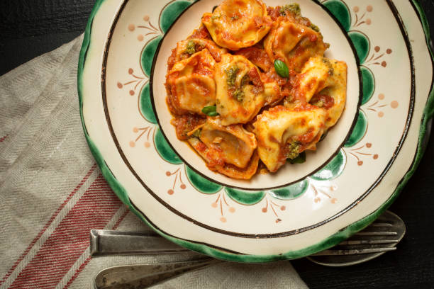 istock Fresh Homemade Tortellini with Tomato Sauce and Mozzarella Cheese on Rustic Plate 965474736