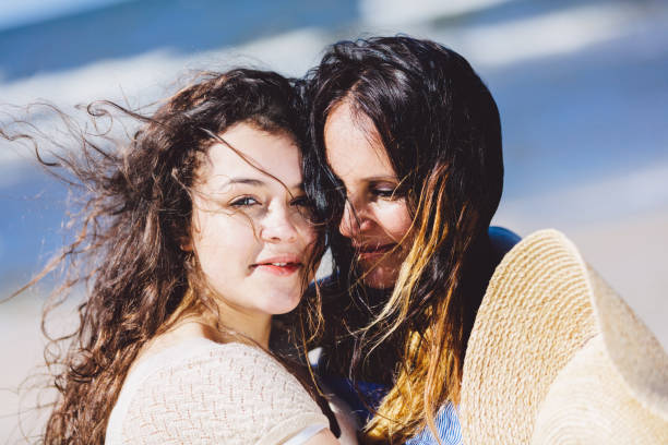 istock Two women, mother and daughter, hugging each other 965478150