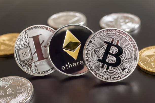 Cryptocurrency coins (Bitcoin, Ethereum, Litecoin) Montreal, CA - 28 May 2018:  Bitcoin, Ethereum and Litecoin crypto currency metallic coins litecoin stock pictures, royalty-free photos & images