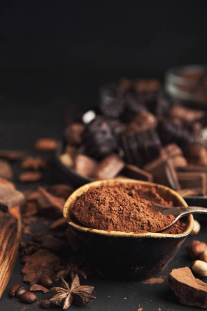 istock Cocoa bowl and crushed chocolate pieces on gray background 965480842